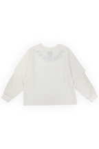 Anthem twofer tee detail showing tonal flame stitching running down the waffle-knit long sleeve