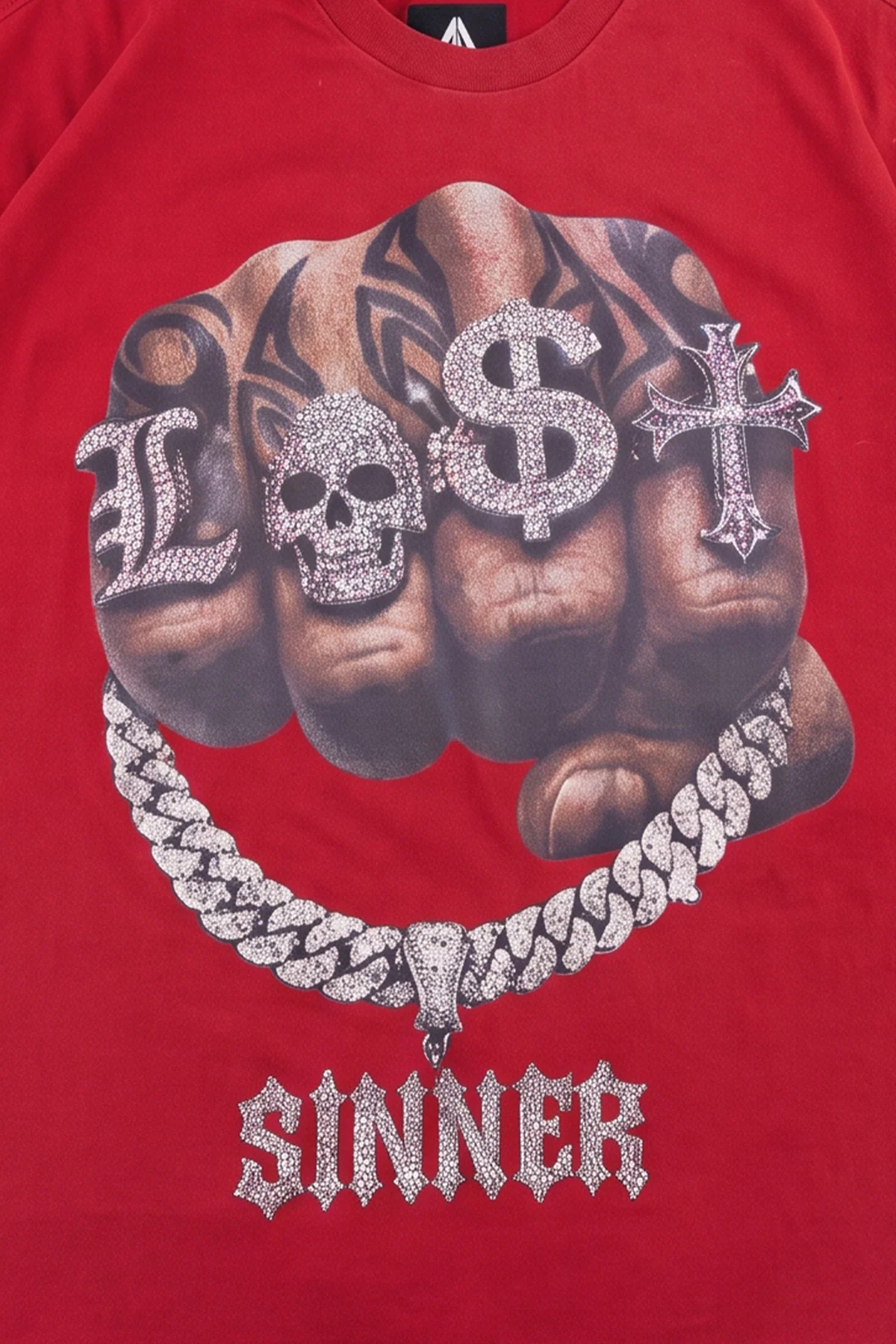 Legacy tee detail showing the diamond Cuban link chain and iced gothic SINNER pendant
